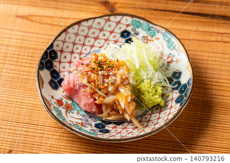 A creative appetizer featuring the perfect balance of fatty negitoro and the tartness of ume suisho (pickled plum). A creative appetizer featuring the perfect balance of fatty negitoro and the tartness of ume suisho (pickled plum). 140793216
