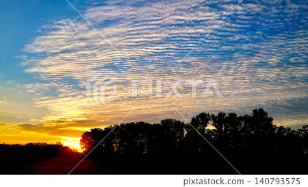 Sunrise over a pasture, morning glow Sunrise over a pasture, morning glow 140793575