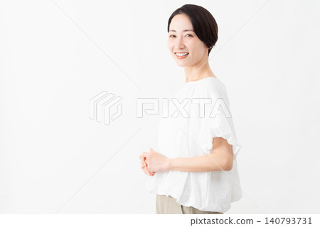 A woman wearing a white blouse - Lifestyle image A woman wearing a white blouse - Lifestyle image 140793731