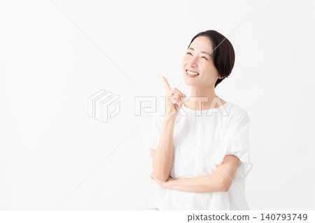 A woman wearing a white blouse - Lifestyle image A woman wearing a white blouse - Lifestyle image 140793749
