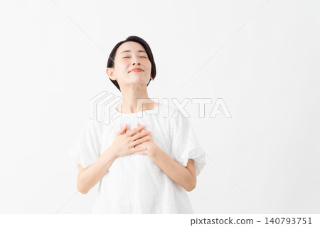 A woman wearing a white blouse - Lifestyle image A woman wearing a white blouse - Lifestyle image 140793751