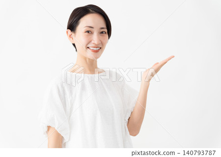 A woman wearing a white blouse - Lifestyle image A woman wearing a white blouse - Lifestyle image 140793787