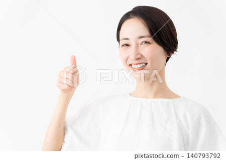 A woman wearing a white blouse - Lifestyle image A woman wearing a white blouse - Lifestyle image 140793792