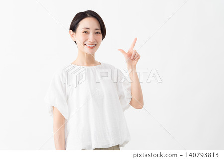 A woman wearing a white blouse - Lifestyle image A woman wearing a white blouse - Lifestyle image 140793813