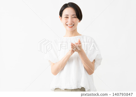 A woman wearing a white blouse - Lifestyle image A woman wearing a white blouse - Lifestyle image 140793847