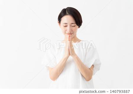 A woman wearing a white blouse - Lifestyle image A woman wearing a white blouse - Lifestyle image 140793887