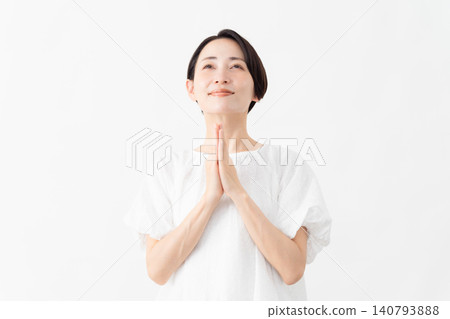 A woman wearing a white blouse - Lifestyle image A woman wearing a white blouse - Lifestyle image 140793888