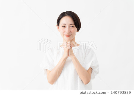 A woman wearing a white blouse - Lifestyle image A woman wearing a white blouse - Lifestyle image 140793889