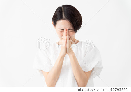 A woman wearing a white blouse - Lifestyle image A woman wearing a white blouse - Lifestyle image 140793891