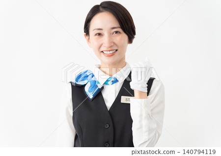 A female attendant in uniform; travel image A female attendant in uniform; travel image 140794119