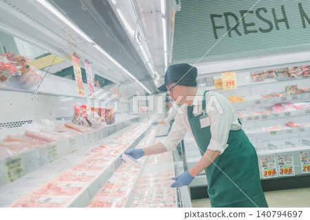 Meat department staff at supermarket Meat department staff at supermarket 140794697