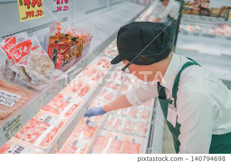 Meat department staff at supermarket Meat department staff at supermarket 140794698