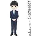 A male office worker standing with a smile 140794907