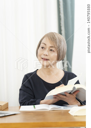 Senior women learning English conversation on their smartphones Senior women learning English conversation on their smartphones 140795880