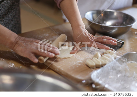 Making gyoza skins by hand 140796323
