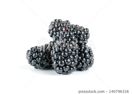 A small pile of ripe blackberries with glossy dark skins, isolated against a clean white background with soft studio lighting and visible texture A small pile of ripe blackberries with glossy dark skins, isolated against a clean white background with soft studio lighting and visible texture 140796326