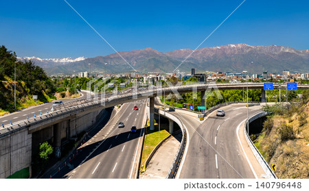Modern highway interchange with traffic and the snow-capped Andes mountains in Santiago, Chile. Modern highway interchange with traffic and the snow-capped Andes mountains in Santiago, Chile. 140796448