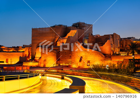 Beautifully illuminated ruins of the historic At-Turaif district above the pedestrian bridge in Diriyah Saudi Arabia during twilight Beautifully illuminated ruins of the historic At-Turaif district above the pedestrian bridge in Diriyah Saudi Arabia during twilight 140796916