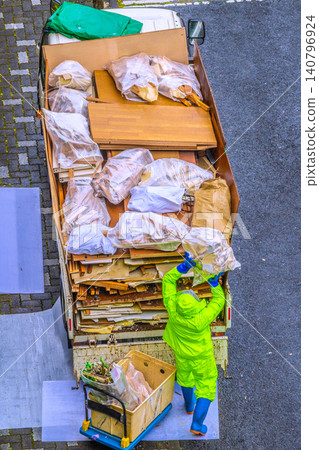Apartment renovation in Yokohama, Japan. Waste materials are being loaded onto trucks one after another. (Yokohama city) Apartment renovation in Yokohama, Japan. Waste materials are being loaded onto trucks one after another. (Yokohama city) 140796924