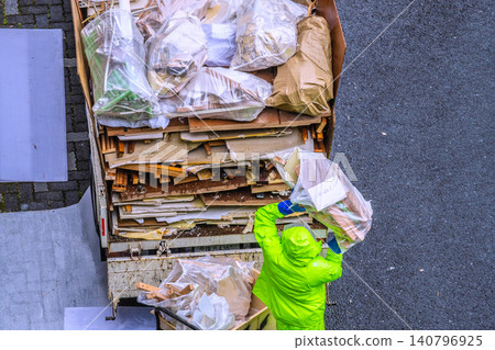 Apartment renovation in Yokohama, Japan. Waste materials are being loaded onto trucks one after another. (Yokohama city) Apartment renovation in Yokohama, Japan. Waste materials are being loaded onto trucks one after another. (Yokohama city) 140796925