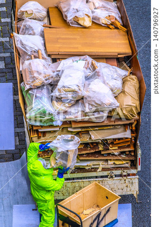Apartment renovation in Yokohama, Japan. Waste materials are being loaded onto trucks one after another. (Yokohama city) Apartment renovation in Yokohama, Japan. Waste materials are being loaded onto trucks one after another. (Yokohama city) 140796927
