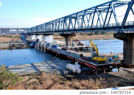 Odakyu Odawara Line, bridge pier reinforcement work on the Sagami River Bridge. Odakyu Odawara Line, bridge pier reinforcement work on the Sagami River Bridge. 140797154