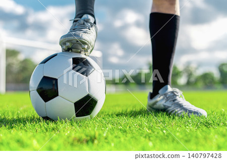 Silver Football Boot POV, Soccer Ball Control Concept, Athlete Foot on Field Media Asset Silver Football Boot POV, Soccer Ball Control Concept, Athlete Foot on Field Media Asset 140797428