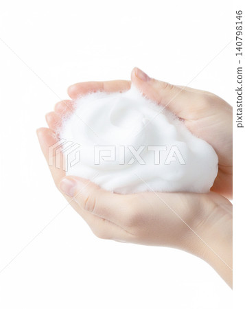 A woman's hand placing a small ball of foam on her palm A woman's hand placing a small ball of foam on her palm 140798146