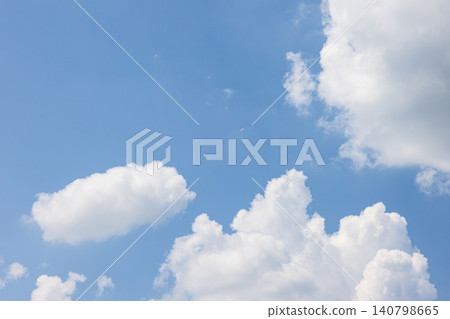 Dynamic white clouds rising up, framing the blue sky. Dynamic white clouds rising up, framing the blue sky. 140798665