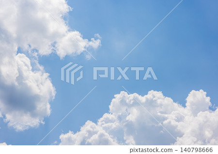 Dynamic white clouds rising up, framing the blue sky. Dynamic white clouds rising up, framing the blue sky. 140798666