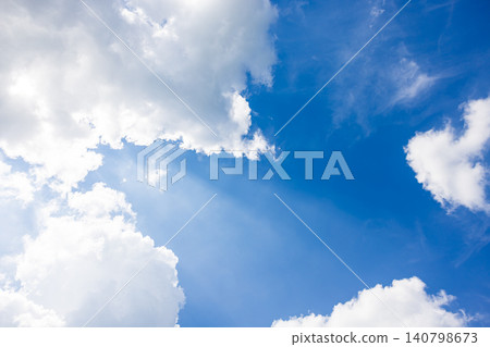 Dynamic white clouds rising up, framing the blue sky. Dynamic white clouds rising up, framing the blue sky. 140798673