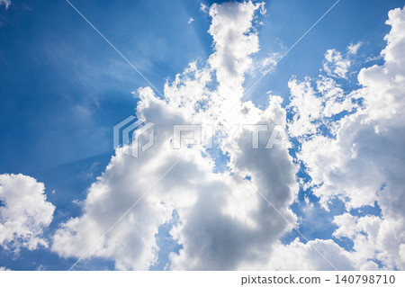 Dynamic white clouds rising up, framing the blue sky. Dynamic white clouds rising up, framing the blue sky. 140798710