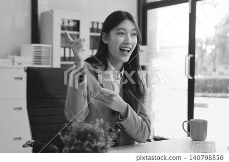 Young businesswoman professional employee using pc doing online banking analysing at workplace. Asian middle-aged business woman working on laptop computer in office, taking notes. Banner, copy space 140798850