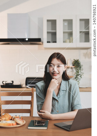 Young adult asian business woman using laptop chat digital artificial intelligence assistance ai chatbot prompt analysis work modern lifestyles 140798921