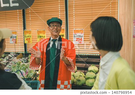 A male store clerk wearing a happi coat at a supermarket A male store clerk wearing a happi coat at a supermarket 140798954