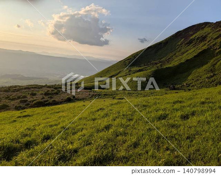 A mountain illuminated by the sunset A mountain illuminated by the sunset 140798994