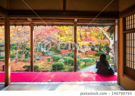 Japanese woman on Enkoji hall terrace view autumn garden, Kyoto Japanese woman on Enkoji hall terrace view autumn garden, Kyoto 140799793