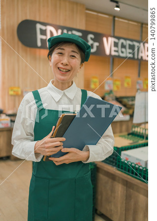 A female part-time worker in her 50s at a supermarket A female part-time worker in her 50s at a supermarket 140799865