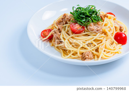 Cold pasta with tuna and cherry tomatoes, garnished with shiso leaves - a perfect summer dish. Cold pasta with tuna and cherry tomatoes, garnished with shiso leaves - a perfect summer dish. 140799968