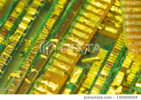 Image of gold plating lifting off a waste circuit board (E-scrap) and recovering (recycling) gold (precious metal). Image of gold plating lifting off a waste circuit board (E-scrap) and recovering (recycling) gold (precious metal). 140800094