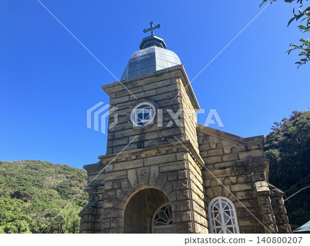 A stone church standing out against the blue sky A stone church standing out against the blue sky 140800207