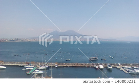 A breathtaking view of the beautiful blue sky and the majestic Mount Vesuvius from the Bay of Naples during a trip to Italy. 140800231