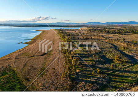 Aerial scene showcasing Lake Keepit and the surrounding rural landscape, highlighting the expansive reservoir, natural shoreline and peaceful countryside in NSW, Australia. Aerial scene showcasing Lake Keepit and the surrounding rural landscape, highlighting the expansive reservoir, natural shoreline and peaceful countryside in NSW, Australia. 140800760