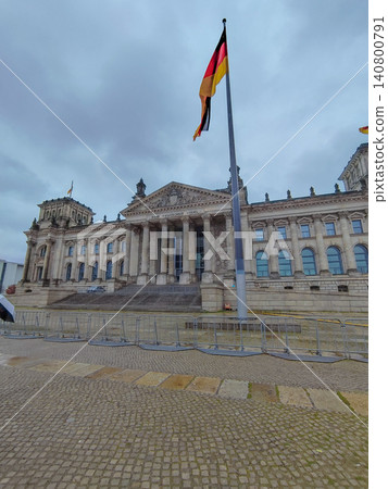 German Reichstag Building in Berlin with Waving National Flag German Reichstag Building in Berlin with Waving National Flag 140800791
