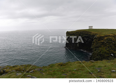 Small white house standing on coastal cliffs at Arnarstapi, Iceland Small white house standing on coastal cliffs at Arnarstapi, Iceland 140800928