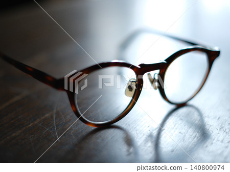 Glasses placed on the desk Glasses placed on the desk 140800974