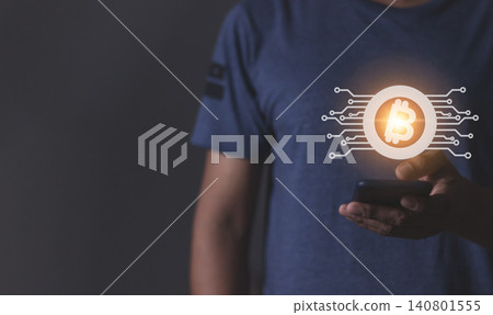 Young man using smartphone hand touching to trade cryptocurrencies online Young man using smartphone hand touching to trade cryptocurrencies online 140801555