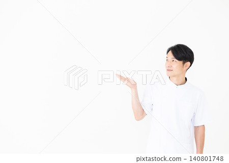 A middle-aged male acupuncturist/osteopath wearing a white coat. A middle-aged male acupuncturist/osteopath wearing a white coat. 140801748