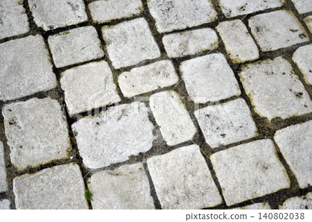 texture of old cobblestone pavement in the street 140802038