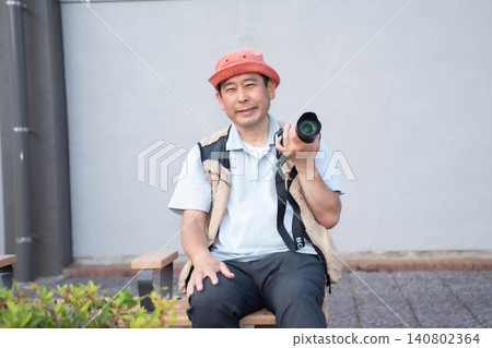 A man with a camera A man with a camera 140802364